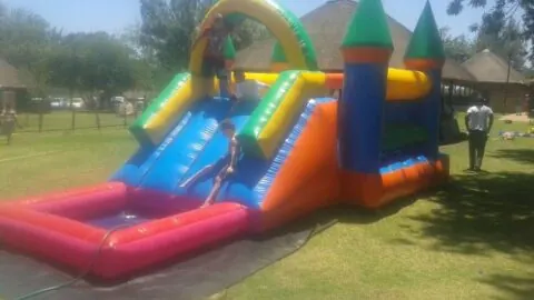 Combo inflatable slide and bounce castle