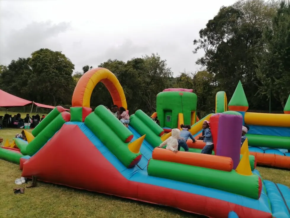 Children enjoying a colourful Bakiddies inflatable event